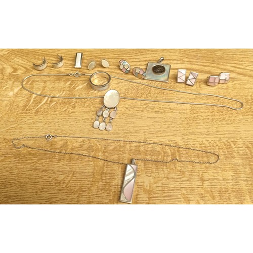 49 - A Selection of silver and mother of pearl jewellery; Ring, various earrings, pendants and silver cha... 