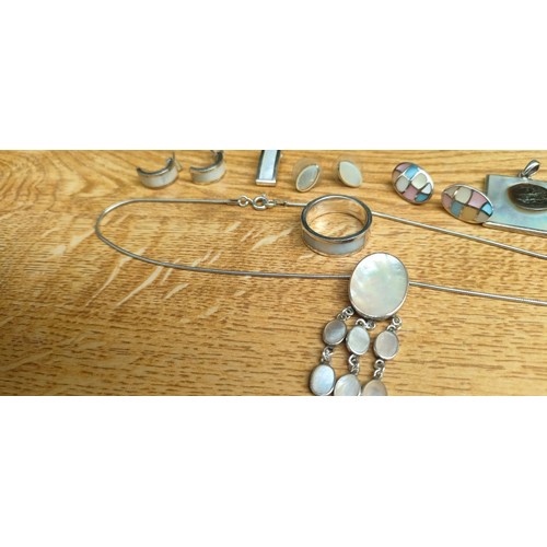 49 - A Selection of silver and mother of pearl jewellery; Ring, various earrings, pendants and silver cha... 