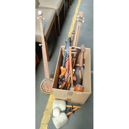 203 - Box of mixed musical instruments to include small banjo, wind and stringed instruments