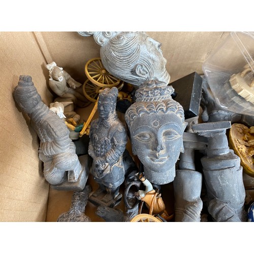 15 - A box of far eastern items to include; stone figurines, busts, and carved display pieces, Buddha Dei... 