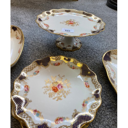 237 - Wedgwood floral design plates and comport dishes; gilt trims and cobalt blue trims