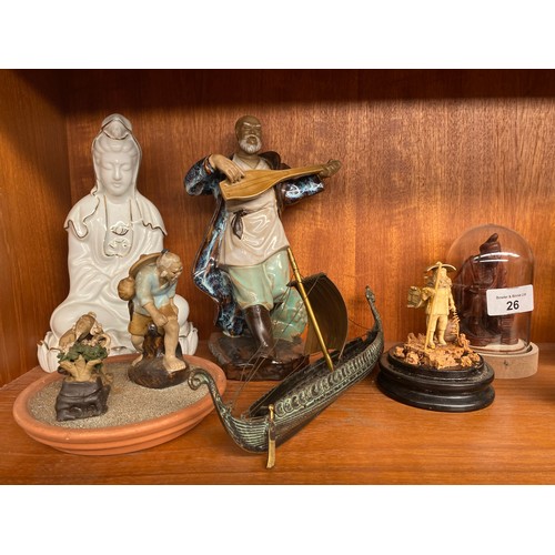 26 - A shelf of oriental collectable figures