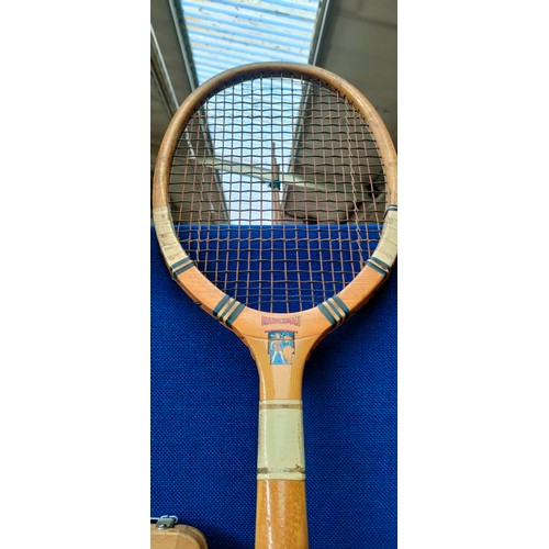 242 - Vintage badminton rackets within a bag along with hickory shafts.  Includes a Tom Grant St Andrews m... 