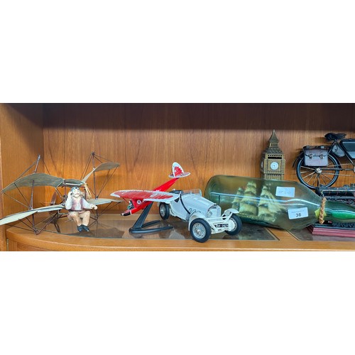 36 - Shelf of collectables transport models; Hot hair balloon, Metal made motorcycle, Ship in a bottle an... 