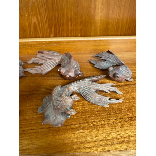 38 - A Collection of Japanese wooden carved goldfish with glass eyes and netsuke carved mouse figure carr... 