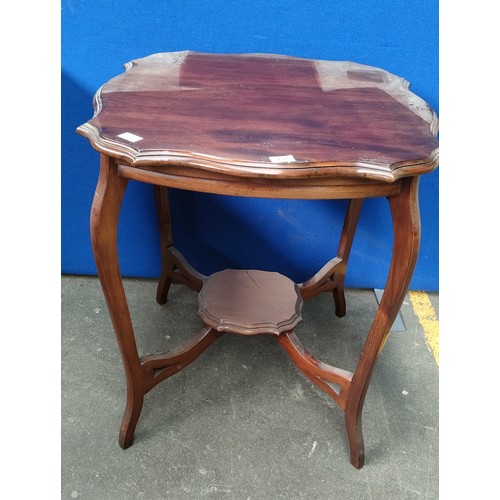 258 - Antique mahogany table, the shaped top above a matching central support with four branches, raised o... 