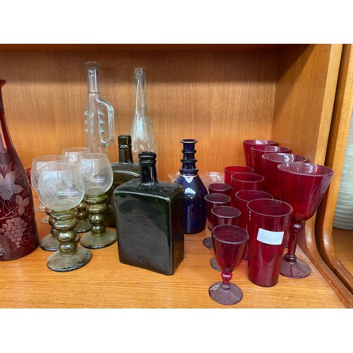 52 - Shelf of antique and vintage art glass; Facet cut ruby glass decanter with stopper, Four green ribbe... 