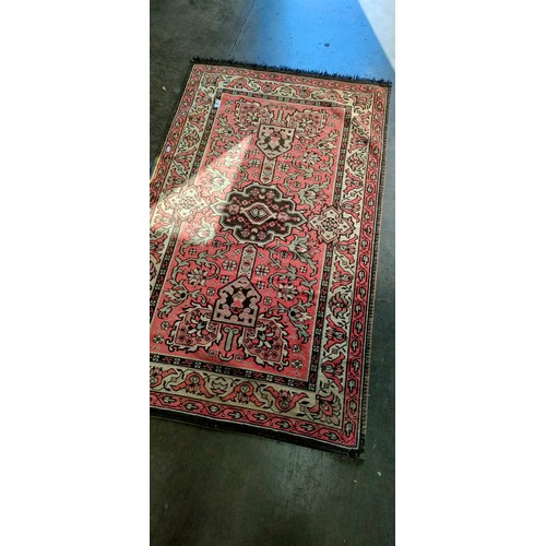 93 - Indian hand woven rug, red ground.