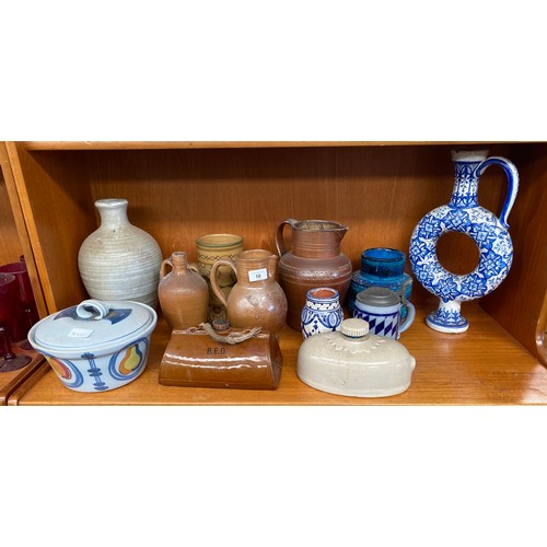 58 - Shelf of collectable pottery and stoneware; Italian Blue glaze vase, Salt glaze stoneware waterjugs ... 