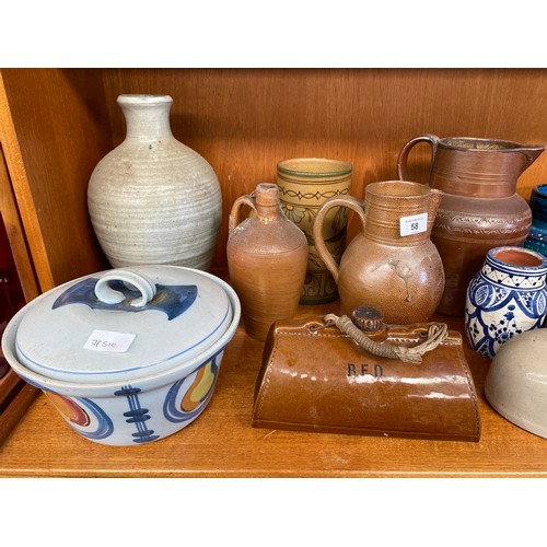 58 - Shelf of collectable pottery and stoneware; Italian Blue glaze vase, Salt glaze stoneware waterjugs ... 