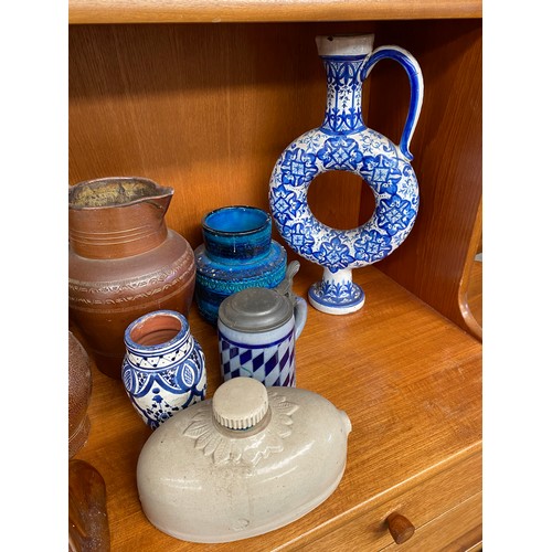 58 - Shelf of collectable pottery and stoneware; Italian Blue glaze vase, Salt glaze stoneware waterjugs ... 