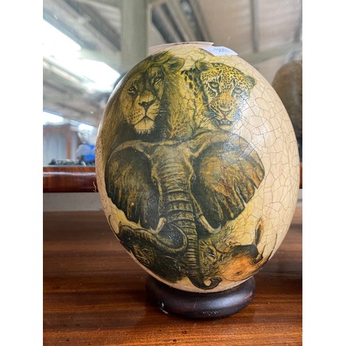 78 - Collectable odds; Ostrich egg, African carved stone bust, carved stone hippo sculpture and two resin... 