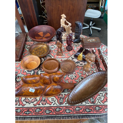 94 - Collection of wooden treen items and carved wooden figures.