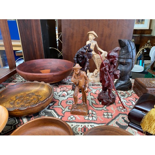 94 - Collection of wooden treen items and carved wooden figures.