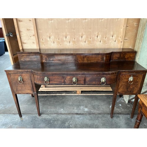 70 - Large Georgian mahogany sideboard; break front and top section, fitted with brass lion head and hoop... 