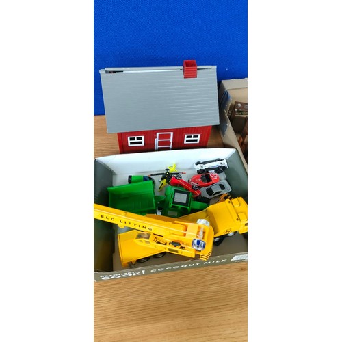 119 - Box of playmobil farm buildings and figures; various vehicle models.