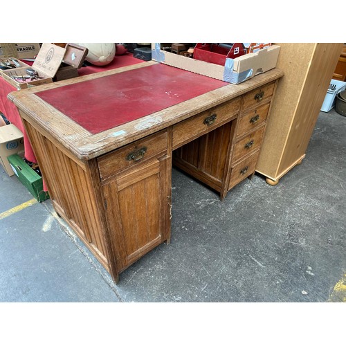 120 - Victorian Oak and red leather topped knee hole writing desk.