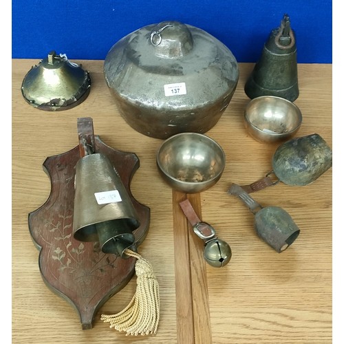 137 - Collection of Singer bells and cow bells; Two Bronze three section cow bells, large brass ringing be... 