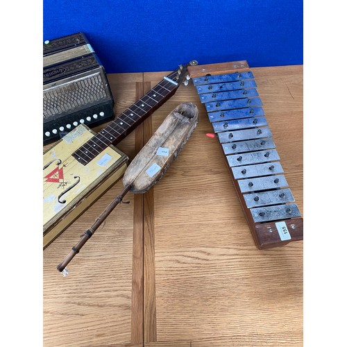 155 - Four musical instruments; Squeeze box, Xylophone and two stringed instruments