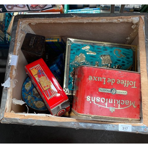 317 - Tea crate containing a collection of mixed advertising tins.