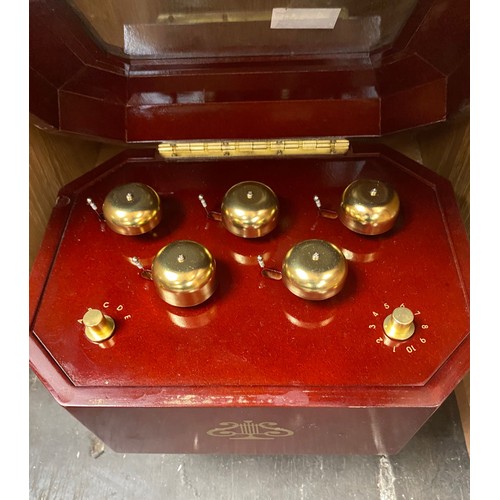 374 - Two shelves of harmonicas and musical bell box and musical miniature drums