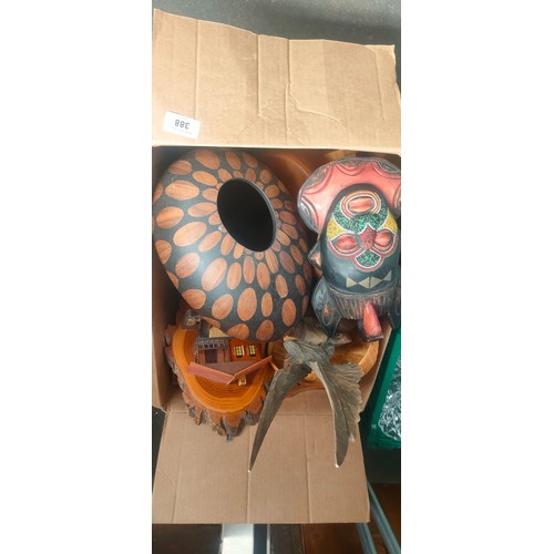 388 - Box of collectable wooden items; Beaded African wall mask and Black Forest style eagle sculpture.