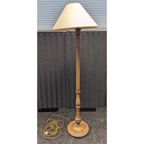 1074 - Antique free standing lamp, raised on a circular base ending in bun feet [152cm]