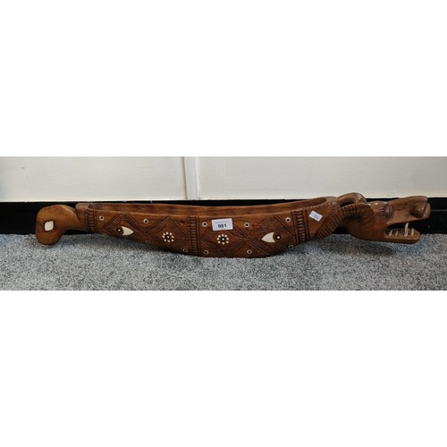 949 - Asian hand carved dragon sculpture with bone inlays. [76cm in length]