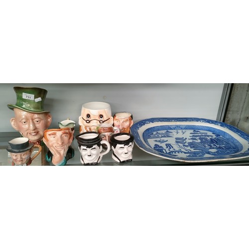 711 - Selection of character jugs and willow pattern platter