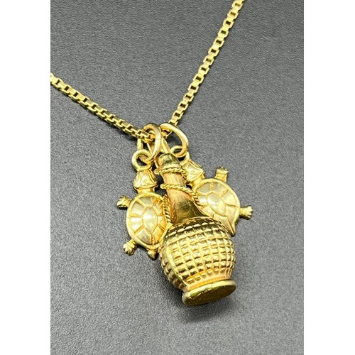 1156 - 18ct yellow gold necklace with an 18ct yellow gold bottle pendant and two 14ct yellow gold turtle pe... 