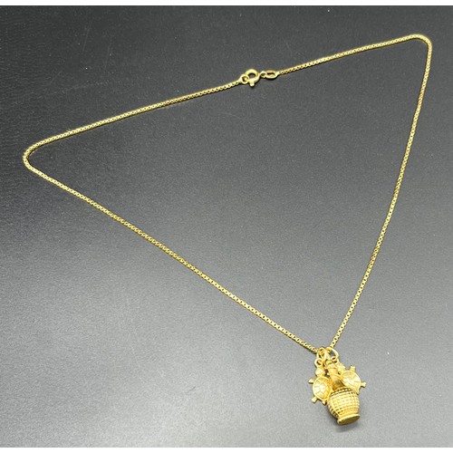 1156 - 18ct yellow gold necklace with an 18ct yellow gold bottle pendant and two 14ct yellow gold turtle pe... 