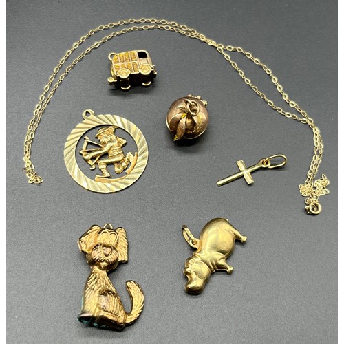 1158 - 9ct yellow gold chain together with six various gold charms/ pendants. [13.96grams]