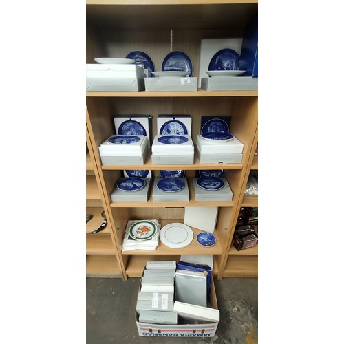 803 - Three shelves and box of collectors plates; Mostly Royal Copenhagen blue and white plates.