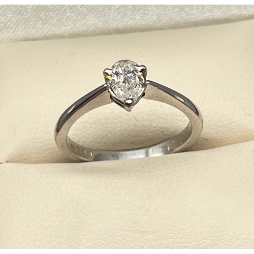 1193 - Ladies Platinum and diamond stone ring, Comprising a single pear shape diamond, secured into a three... 