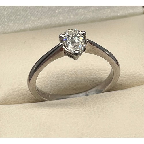 1193 - Ladies Platinum and diamond stone ring, Comprising a single pear shape diamond, secured into a three... 