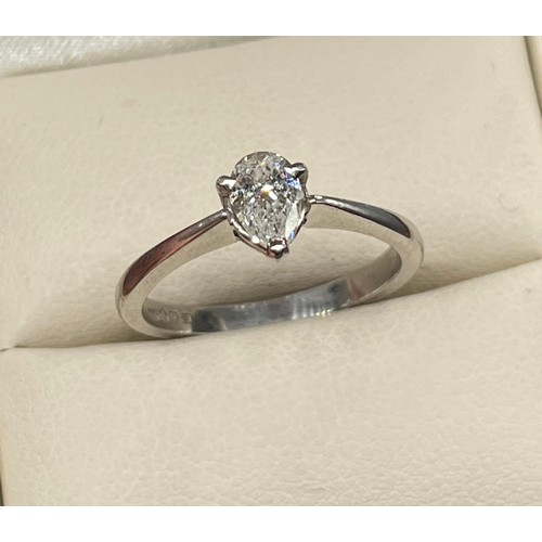 1193 - Ladies Platinum and diamond stone ring, Comprising a single pear shape diamond, secured into a three... 