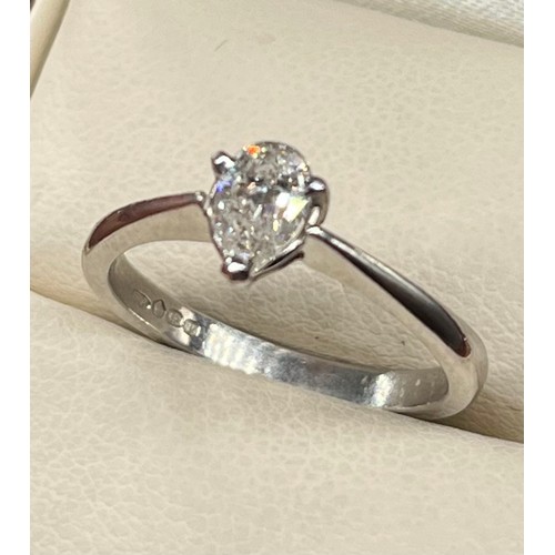 1193 - Ladies Platinum and diamond stone ring, Comprising a single pear shape diamond, secured into a three... 