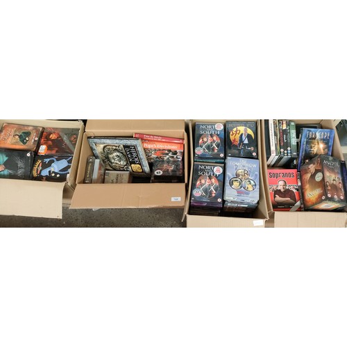 745 - Four boxes of mixed box Sets of DVD's and book; North and South, Futurama, Farscape and many others