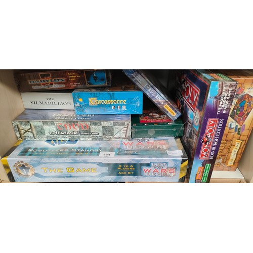 744 - A Shelf of Sealed board games; Lord of the Rings, Robot Wars The Game, Monopoly, Harry Potter Trivia... 