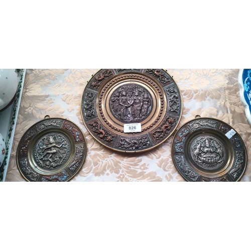 826 - Three Far Eastern, silver, copper and brass worked decorative plates.