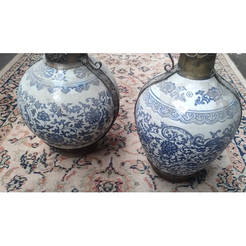 855 - Two Chinese blue and white and metal worked vessel pots with lids.