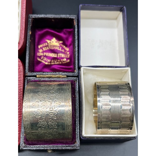 1176 - Four various boxed Silver napkin rings; Pair of silver machine worked napkin rings, Victorian Edinbu... 