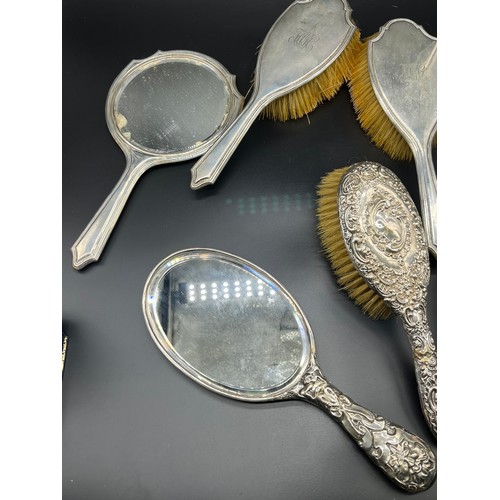 1186 - A Selection of silver hand brushes and mirror.