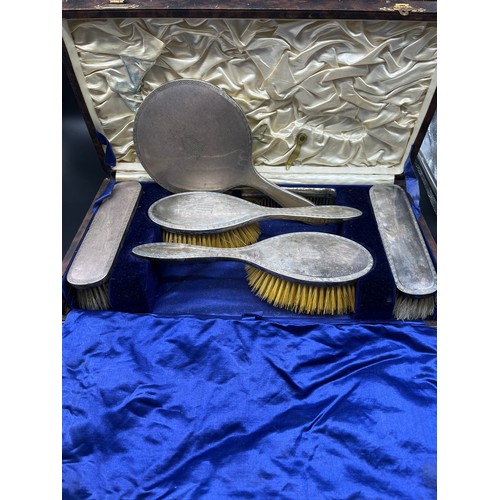 1192 - Boxed Birmingham silver dressing table hand brushes and hand mirror.