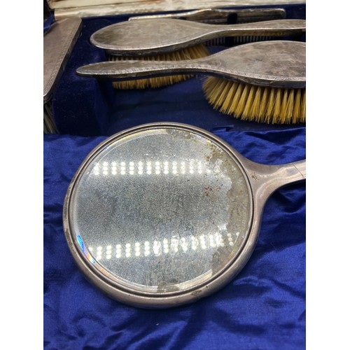 1192 - Boxed Birmingham silver dressing table hand brushes and hand mirror.