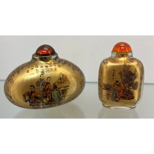 1227 - Three various Chinese perfume/ snuff bottles, One with blue raised relief cut section designs.