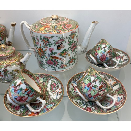 1228 - Chinese Famille Rose design hand painted Tea pots, cups and saucers. Three tea pots, five cups and s... 