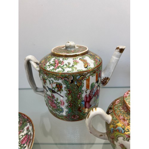 1228 - Chinese Famille Rose design hand painted Tea pots, cups and saucers. Three tea pots, five cups and s... 