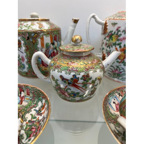 1228 - Chinese Famille Rose design hand painted Tea pots, cups and saucers. Three tea pots, five cups and s... 