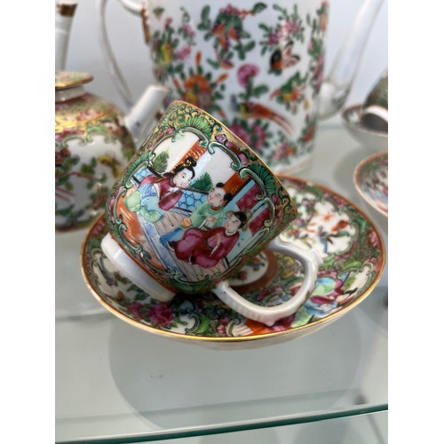 1228 - Chinese Famille Rose design hand painted Tea pots, cups and saucers. Three tea pots, five cups and s... 